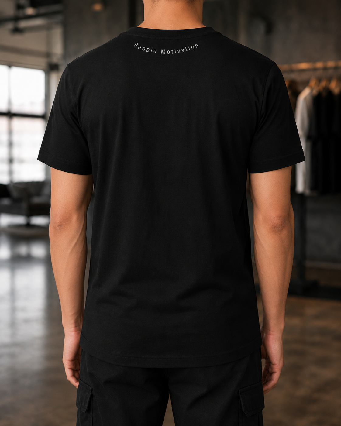 Back view of PPM black tee with People Motivation neck mark